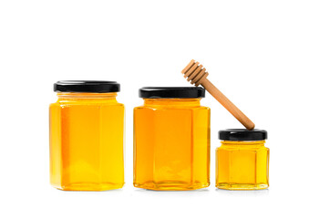 Honey in jars on a white background close-up.