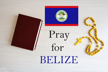 Pray for Belize. Rosary and Holy Bible background.