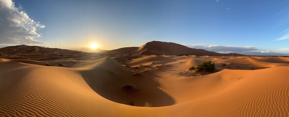 Dunes in the Sahara desert, Merzouga desert, grains of sand forming small waves on the dunes,...