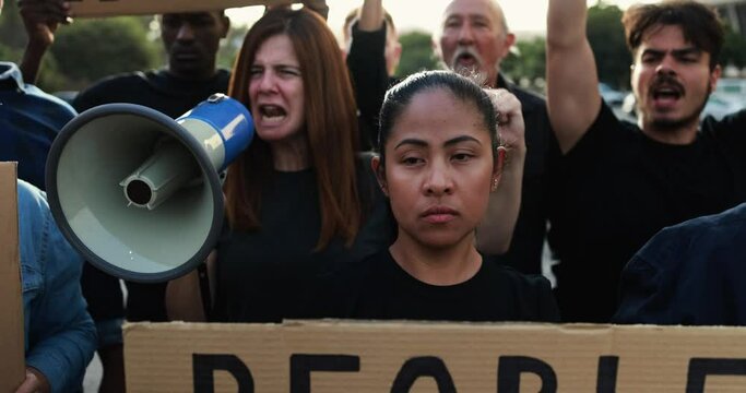 Group of multiracial people protest against inflation and financial crisis - Protesters marching for rise cost of living outdoor