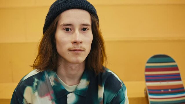 Young skater making jump, performing trick, skateboarder training in skatepark, making tricks, slides and flips, jump over the gap, professional extreme sport athlete ride on skateboard. 