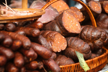 Ham, hamon iberico, pančeta, chorizo, kulen, pršut i fresh kobasice sausages on the traditional meat food market in Belo Blato, Serbia