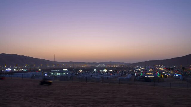 Liwa Moreeb dune car race festival in Abu Dhabi, visitor enjoy riding and camping near the tallest sand dune