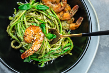 zucchini spaghetti with shrimp. Vegetarian vegetable low carb pasta, Restaurant menu, dieting, cookbook recipe top view