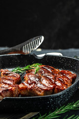 pork steak with herbs and spices on the grill pan, Restaurant menu, dieting, cookbook recipe place for text