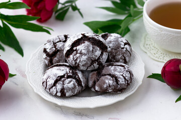 Delicious postcard with chocolate chip cookies and peonies on a white background