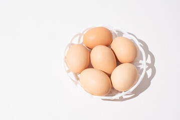 Eggs in bowl on white background, Easter eggs. Protein food