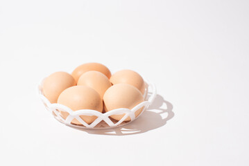 Eggs in bowl on white background, Easter eggs. Protein food