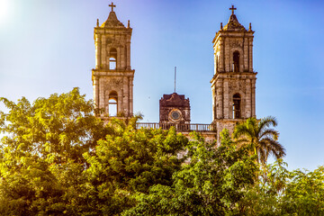 Fototapeta na wymiar Cathedral and church of San Servacio in the city of Valladolid in America specifically in the Yucatan Peninsula (Mexico), is built with its towers and respective bell towers that reach the blue sky.
