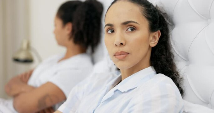 Lesbian, anger and couple in bed, frustrated or disagreement with toxic behavior, fight or ignore. Angry, women or partners in bedroom, divorce or gay people with marriage issues, problems or breakup