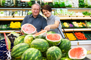 elderly husband and wife choose high-quality watermelon