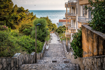 Stone stairs leading down to the sea. Ancient stone steps in Budva