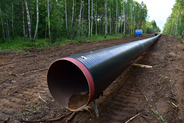 Natural Gas Pipeline Construction. Crude oil transmission in pipe from gas storage and LNG plant to facility. Pipelayer on Oil and Gas petrochemical pipes project. Build a natural gas Pipeline