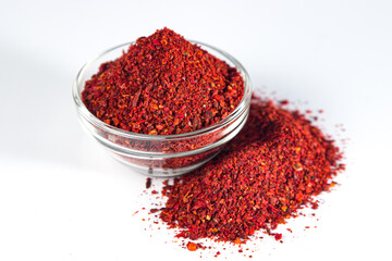 Crushed paprika on a white background. traditional spice