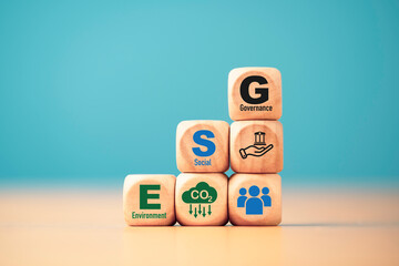 ESG wording on wooden cube block for sustainable organization development and corporation of...