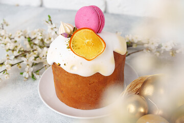Easter cake and golden eggs on table
