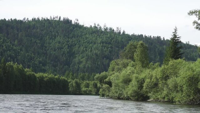 Middle Siberia, Krasnoyarsk Territory. Hilly (coniform hill) river bank, pour. Taiga mixed forests