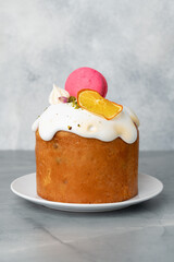 Beautiful Easter cake decorated with macarons cookie and dry orange piece