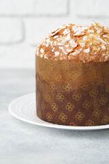 Easter cake with sugar powder on gray background