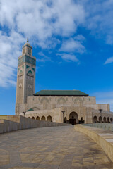 Fototapeta na wymiar View of the beautiful mosque Hassan 2, and a seagull flying in Casablanca Morocco