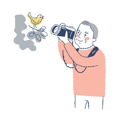 鳥を撮影するシニア男性