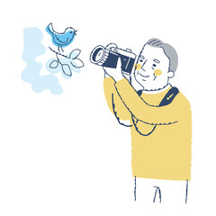 鳥を撮影するシニア男性