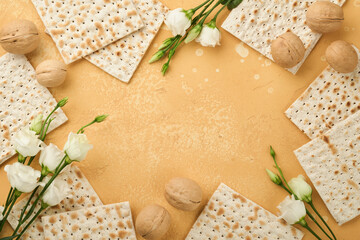 Matzah Passover celebration concept. Traditional ritual Jewish bread on sand color old wall background. Passover food. Pesach Jewish holiday of Passover celebration concept. Passover food.