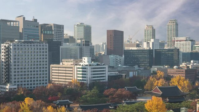 Seoul South Korea time lapse 4K, city skyline timelapse at Deoksugung Palace and Seoul City Hall in autumn