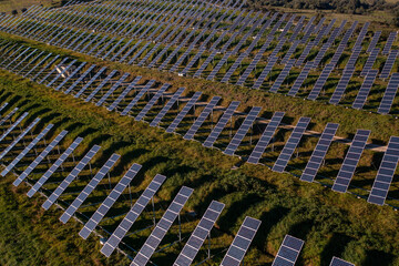 Aerial view flying over a solar panel farm