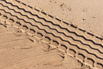 Tire track on the beach. Tire footprint in the sand