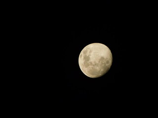 Moon on the 3rd of April 2023  a Waxing Gibbous moon phase, against a pitch black night sky. The moon is more than 50% illuminated but has not yet reached 100% illumination