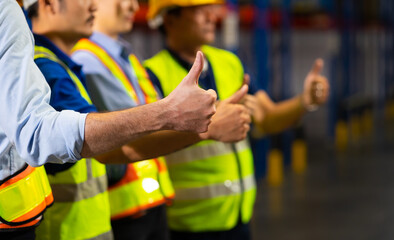 Thumb up. Unity and teamwork concept. team standing hands together. Professional Mechanical Engineer team Working at warehouse store.