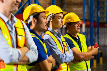 stand with arms crossed. Unity and teamwork concept. team standing hands together. Professional Mechanical Engineer team Working at warehouse store.