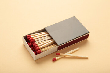 Box of matches on a beige background