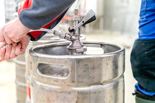 beer keg connected in pub. beer keg head