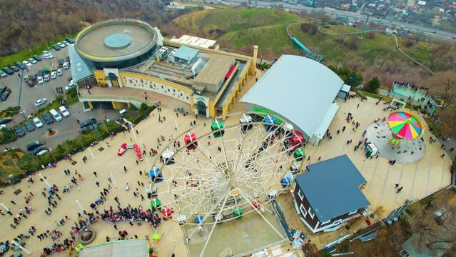 Aerial view of Ferris wheel and carousel on Kok Tobe, Almaty
