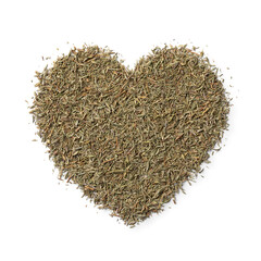 Dried Thyme in heart shape close up isolated on white background