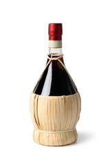 Traditional Italian bottle with Chianti wine close up isolated on white background