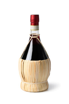 Traditional Italian bottle with Chianti wine close up isolated on white background