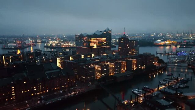 Establishing Aerial View Shot of Hamburg De, Mecklenburg-Western Pomerania, Germany, at night evening, rathaus, city falling asleep