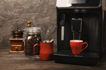 Coffee machine in modern kitchen interior. Fresh black aromatic coffee made in a home coffee-maker. morning coffee. Home Coffee machine in the kitchen. Place for text. copy space.