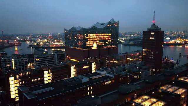 Establishing Aerial View Shot of Hamburg De, Mecklenburg-Western Pomerania, Germany, at night evening, rathaus, city falling asleep