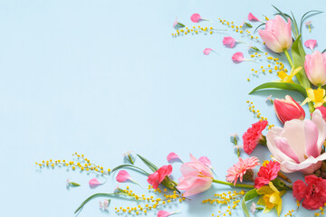 beautiful spring flowers on blue background © Maya Kruchancova