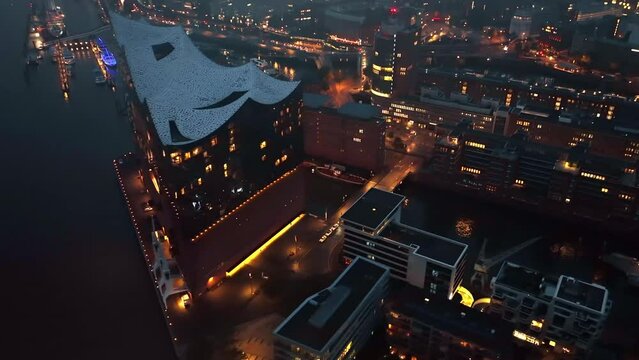 Establishing Aerial View Shot of Hamburg De, Mecklenburg-Western Pomerania, Germany, at night evening, rathaus, city falling asleep