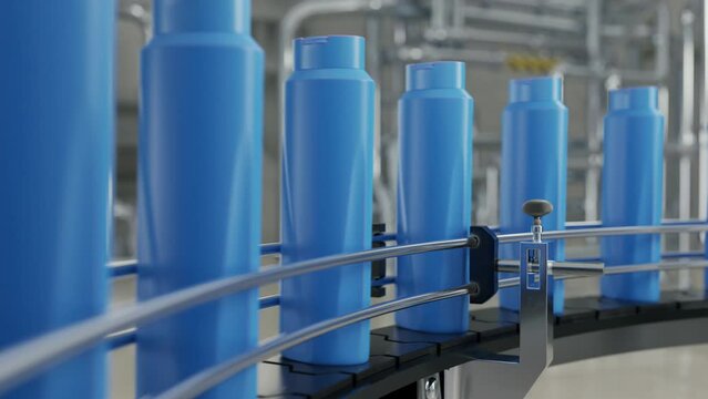 Automated conveyor belt carrying the plastic product containers at a facility. Conveyor belt transporting the shampoo bottles at a facility. Conveyor belt moving the manufactured items at a facility.