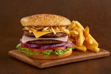 hamburger with fries on the table