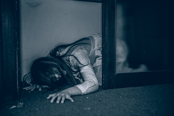 Portrait of asian woman make up ghost face with blood,Horror scene,Scary background,Halloween...