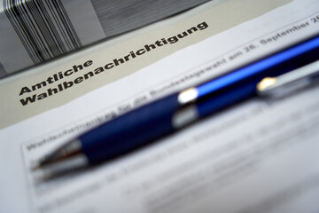 Official election notification (Wahlbenachrichtigung Bundestagswahl) for the federal election in germany. Blue pen depth of field.