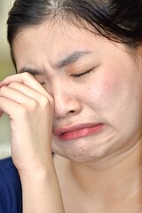 Fototapeta premium A Crying Filipina Female Woman