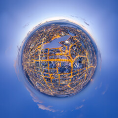 Aerial winter city view with crossroads and roads, houses, buildings, parks and bridges. Copter...